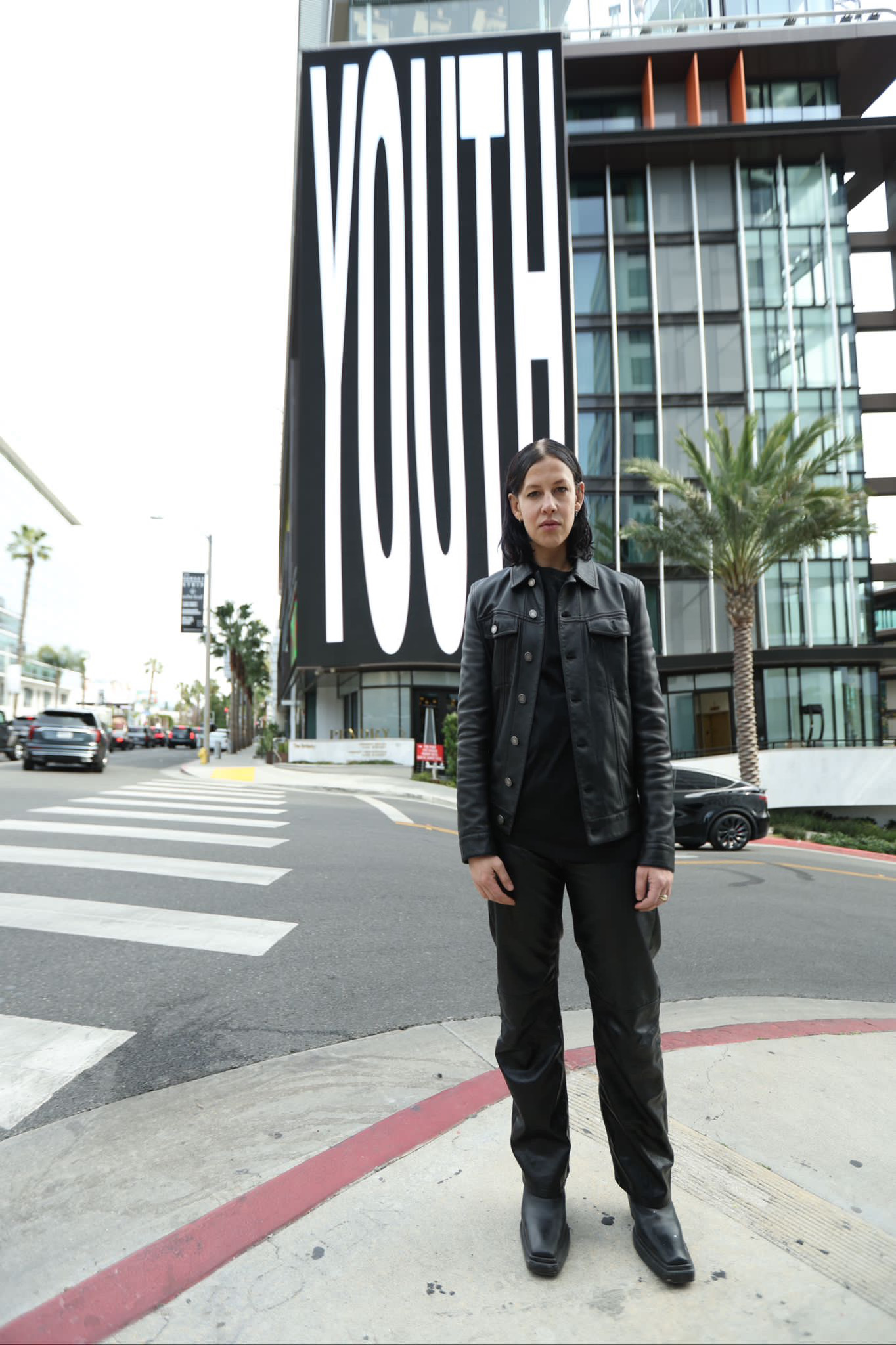 Anne Imhof standing in front of Pendry West Hollywood, Sunset Boulevard, for the launch of #YOUTH24 during Frieze LA 